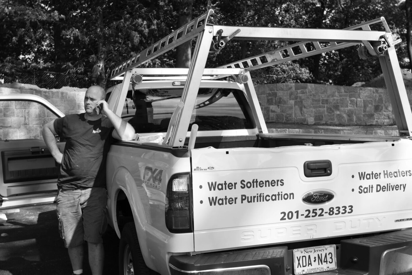 man leaning against truck