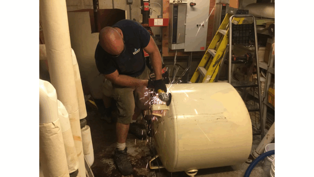 Technician Angle Grinding Tank